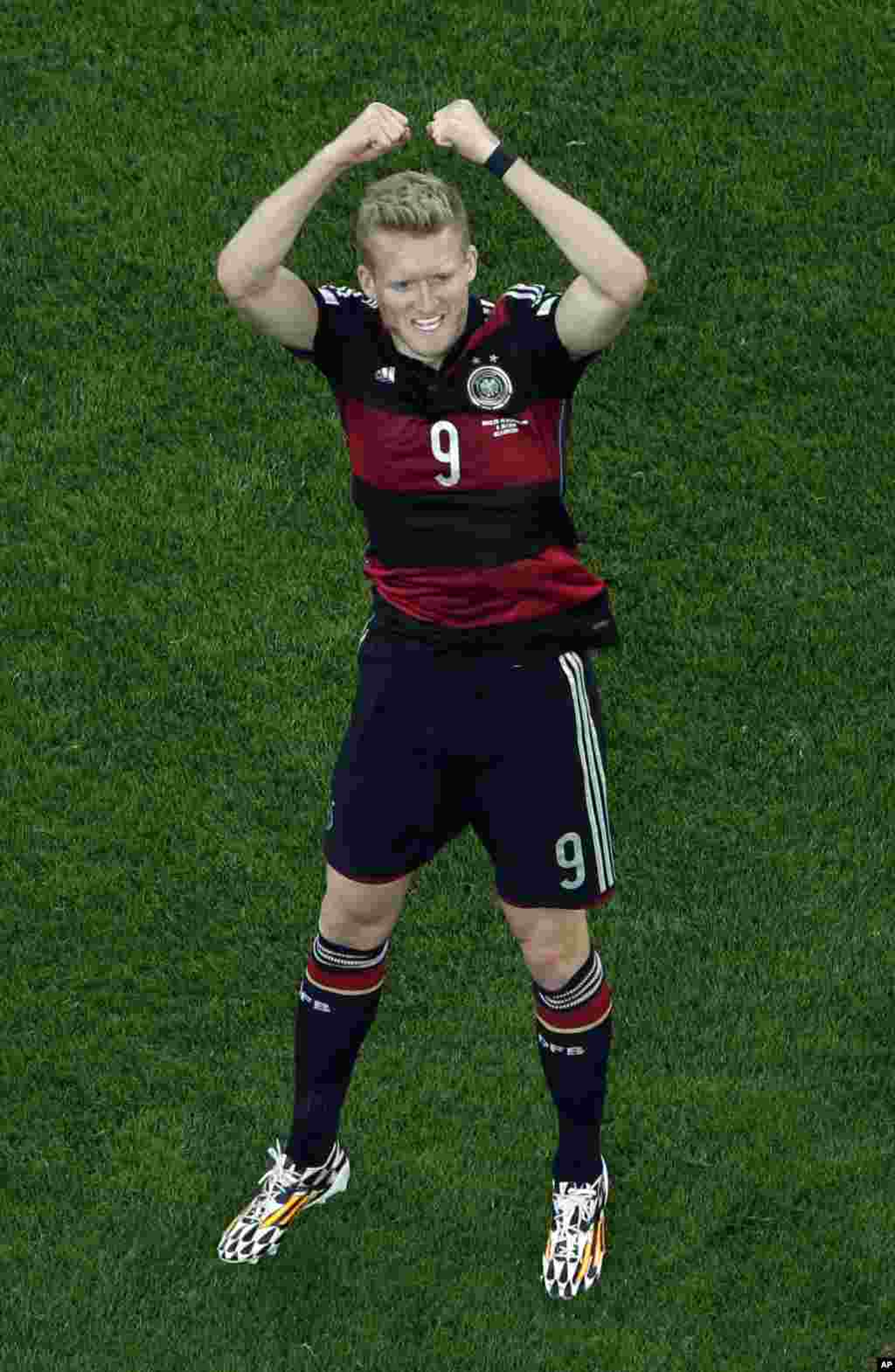 Germany's Andre Schuerrle celebrates scoring his side's 6th goal during the World Cup semifinal soccer match between Brazil and Germany at the Mineirao Stadium in Belo Horizonte, Brazil, July 8, 2014.