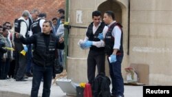 Police inspect the site of an attack on a church in the Helwan district south of Cairo, Egypt, Dec. 29, 2017.