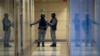 Security officers standing guard at the Alexei Navalny's Foundation for Fighting Corruption office in Moscow, Russia, Thursday, Nov. 5, 2020. (AP Photo/Pavel Golovkin)