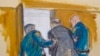 In this courtroom sketch, Harvey Weinstein, center, is led out of Manhattan Supreme Court by court officers after a jury convicted him of rape and sexual assault, in New York, Feb. 24, 2020.