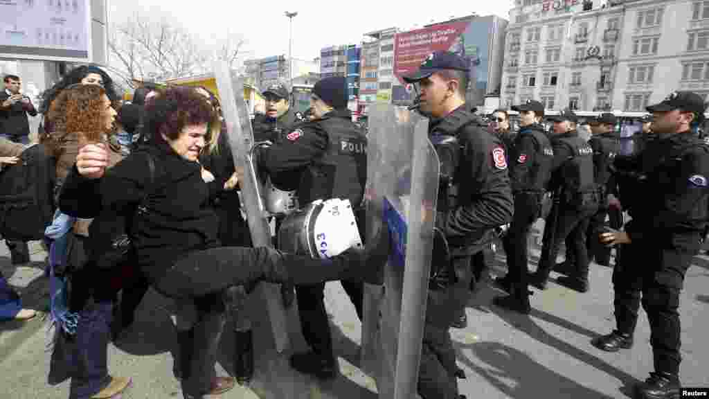 Demonstrators are stopped by the police during a protest ahead of the International Women's Day, in Istanbul, Turkey, March 6, 2016. 