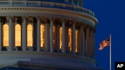 FILE - An American flag flies on the Capitol Dome in Washington, July 16, 2019. The Treasury Department released its federal budget data on Sept. 12, 2019.