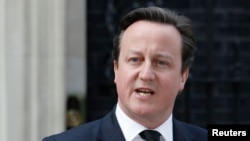 British Prime Minister David Cameron moved to end a revolt over European Union membership in his ruling Conservative party saying all his ministers backed his strategy on the issue despite two expressing more sceptical views than his own, (File photo).