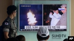 FILE - A South Korean army soldier watches a TV news program showing images of North Korea's ballistic missile launch and North Korean leader Kim Jong Un, at Seoul Railway station in Seoul, South Korea, Aug. 25, 2016.