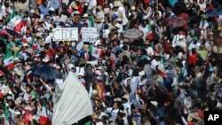 Demonstrators march demanding respect for Mexico and its migrants, in the face of perceived hostility from the administration of U.S. President Donald Trump, in Mexico City, Sunday, Feb 12, 2017.