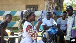 A Red Cross volunteer talks about coronavirus prevention in Beni, eastern Congo.