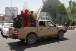 Talibanski borci u vozila u gradu Herat, zapadno od Kabula, Afganistan, 14. august 2021.