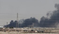 Smoke is seen following a fire at an Aramco facility in the eastern city of Abqaiq, Saudi Arabia, Sept. 14, 2019.