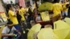 FILE - People sell umbrellas to supporters of pro-democracy group "Bersih" (Clean) near Dataran Merdeka in Malaysia's capital city of Kuala Lumpur, Aug. 30, 2015.