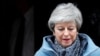 FILE - Britain's Prime Minister Theresa May leaves 10 Downing Street, as she faces a vote on alternative Brexit options, in London, Britain, March 27, 2019.