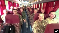 Російські військовики, звільнені з українського полону внаслідок обміну, 14 вересня 2024. Міноборони РФ/AP