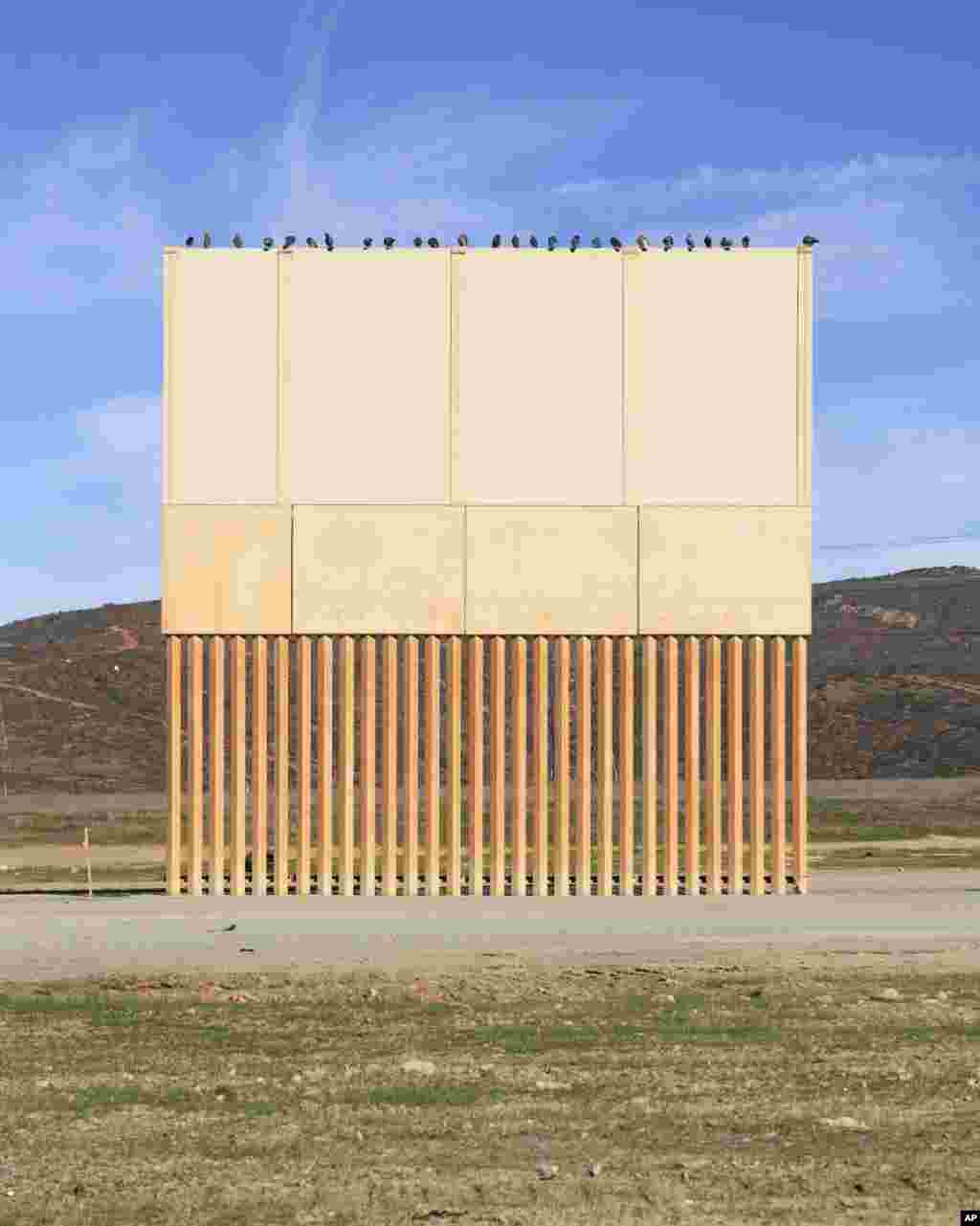 A border wall prototype stands in San Diego near the Mexico-U.S. border, seen from Tijuana, Mexico, Dec. 22, 2018. 