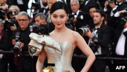 (FILE) This file picture taken on May 11, 2018 shows Chinese actress Fan Bingbing posing as she arrives for the screening of the film "Ash is Purest White" at the 71st edition of the Cannes Film Festival in Cannes, southern France.