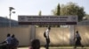 People pass by the Ministry of Petroleum and Mining in Juba, November 7, 2012. 