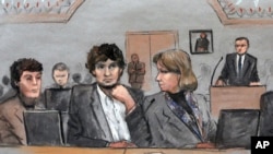 FILE - In this courtroom sketch, Dzhokhar Tsarnaev, center, is depicted between defense attorneys Miriam Conrad, left, and Judy Clarke during his federal death penalty trial, March 5, 2015, in Boston. 
