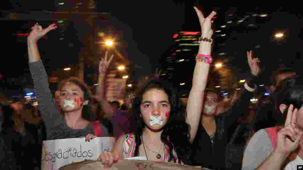 Demonstrators march in protest for the disappearance of 43 students in the state of Guerrero, in Mexico City, Nov. 5, 2014. 